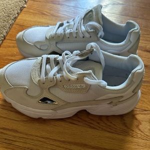 Used. White adidas sneakers.